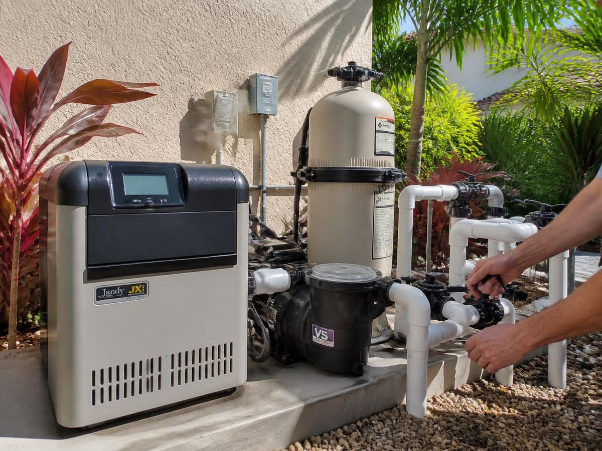 Gas pool heater and variable speed pump on an equipment pad at a Florida home