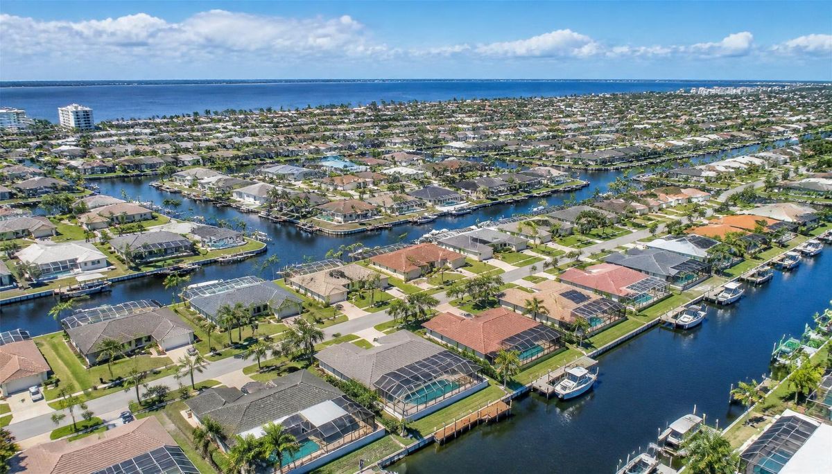 Aerial view of Cape Coral Florida canal neighborhoods with screened pools